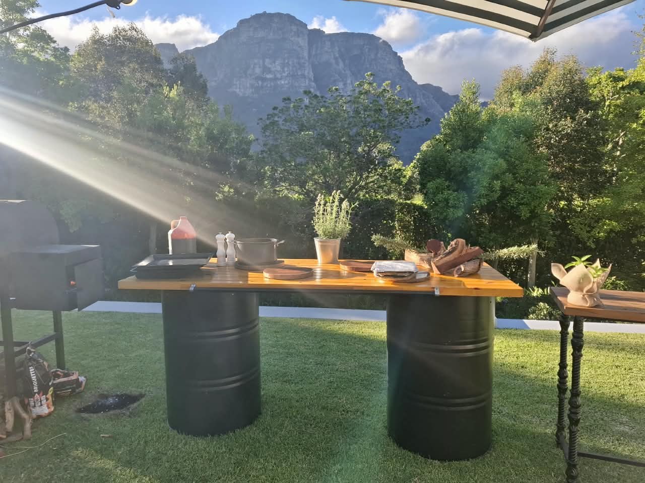 BBQ station beneath umbrellas